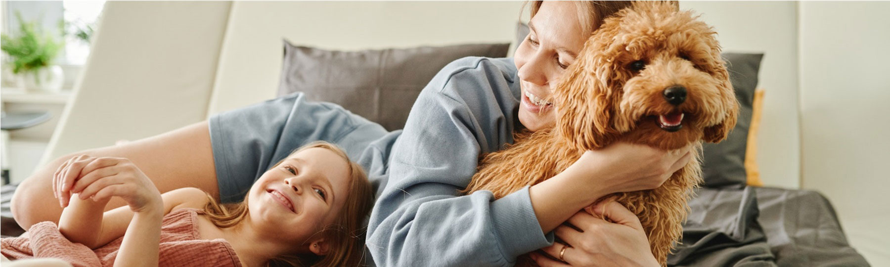 family with dog on the couch